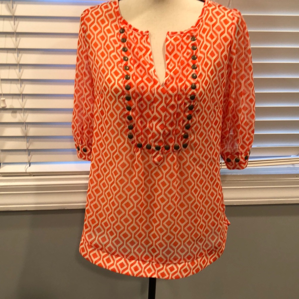 Orange and white shirt.